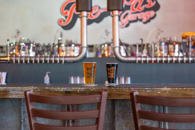The bar at Pee-Pa's Garage under purple lights