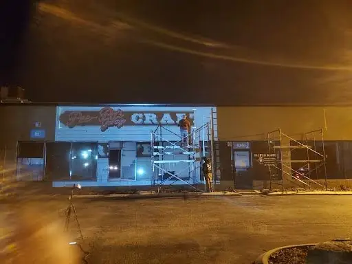 Painting the sign at night