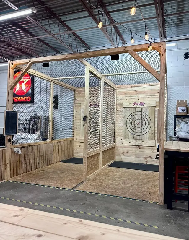 The axe throwing corner with vintage signs