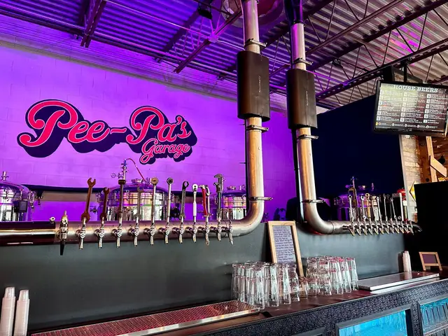 The Pee-Pa's Garage logo wall inside the brewery