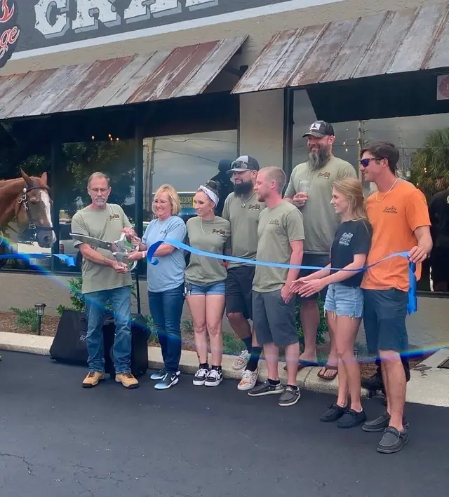 Cutting the ribbon at the grand opening